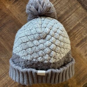 Women’s Under Amour beanie with poof on top